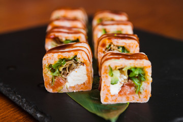 Delicious rolls with fish and cheese	