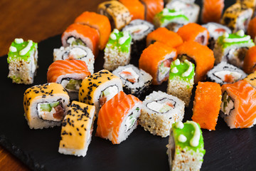 Delicious rolls with fish and cheese	