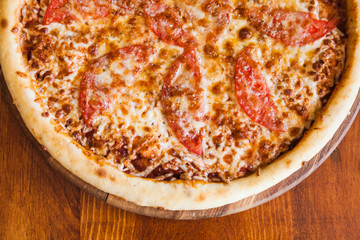 elicious pizza with meat, cheese and mushrooms