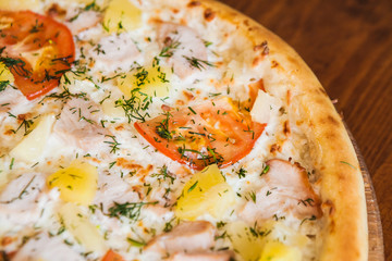 elicious pizza with meat, cheese and mushrooms