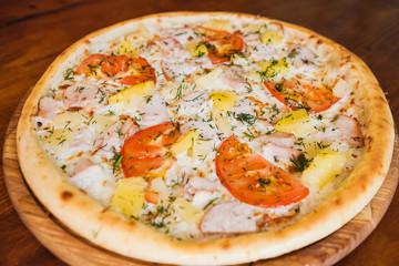 elicious pizza with meat, cheese and mushrooms