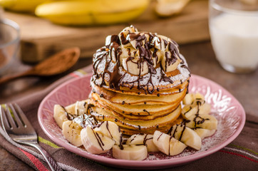 American pancakes with banana, chocolate