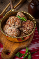 Fried pork chops in the pan.