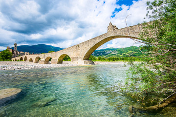 Fototapeta na wymiar ancient medieval bridge - italian landscape Emilia Romagna Italy
