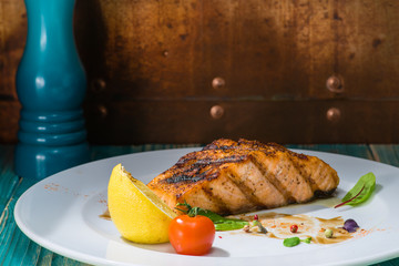 cooked salmon at a white plate