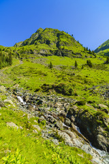 Beautiful scenery with a mountain river in the Fagarasi Mountains Romania