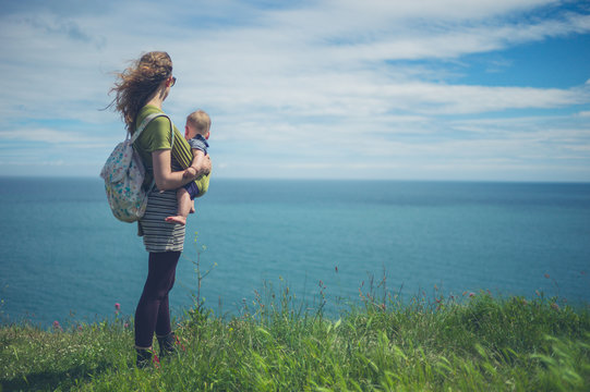 Woman with baby by the sea