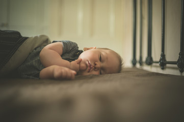 Little baby sleeping on the bed