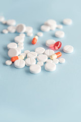 Close up of a heap of white tablets