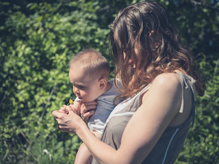 Obraz premium Mother with baby in nature