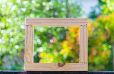 Picture frame on blurred tree background using wallpaper or background.