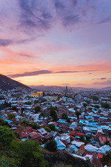 Sunset panorama view of Tbilisi, capital of Georgia country, from Narikala fortress.