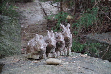 little stone bunnies statue in the park