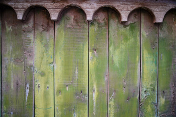 Green wooden old plank texture as background. Closeup