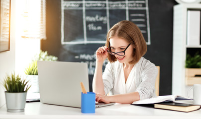 Happy businesswoman woman student with computer and mobile phone