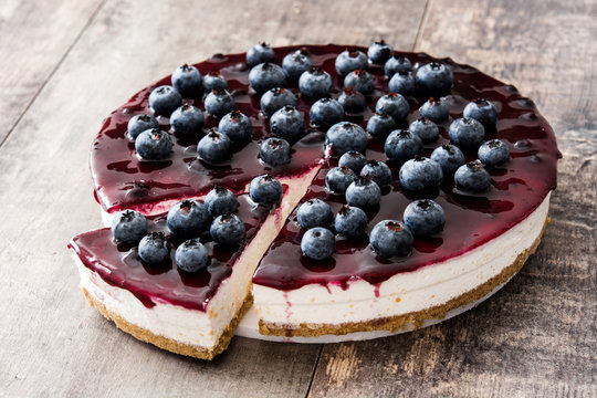 Blueberry cheesecake on wooden table
