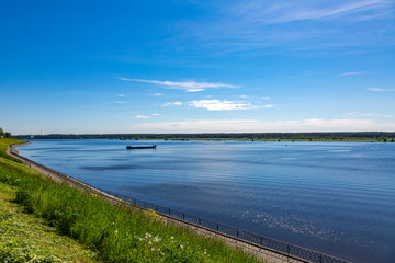 Fototapeta na wymiar The shore of the grandiose Russian Volga river near the town of Myshkin on a summer day. Yaroslavl region 