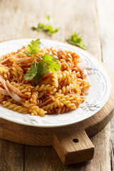 Pasta with ham and tomato sauce