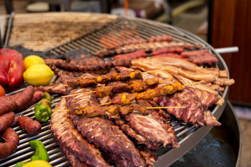 Street food in San Fermin feast, Pamlona, Navarra, Spain. Pork. Grilled meat. Spanish traditional cuisine. Spanish national dish.