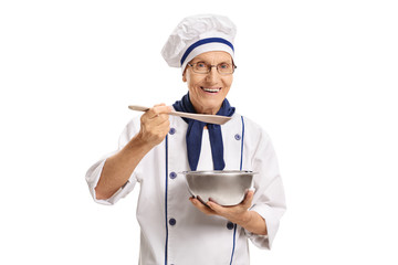 Chef holding a pot and a spoon