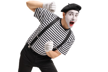 Mime behind an imaginary panel