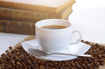 cup of black coffee and a books