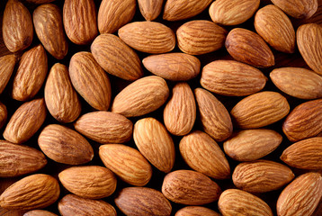 Peeled almonds closeup. Nuts background.