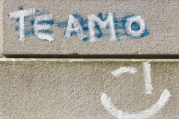 Painted words te amo on stone wall