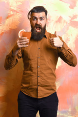 Brutal caucasian hipster holding tropical alcoholic fresh cocktail