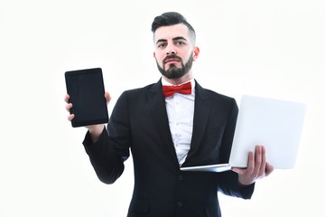 Confident businessman or head manager, white laptop and black tablet