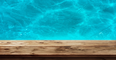 Fototapeta na wymiar Swimming pool with a wooden edge_001