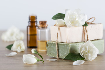 Obraz na płótnie Canvas Handmade soap, jasmine blossom, jasmine essential oil