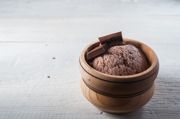 Chocolate ice cream on a rustic background,