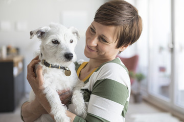 Woman with her dog at home