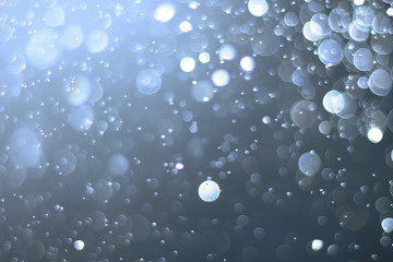 A beautiful and blurry bokeh on a blue background.