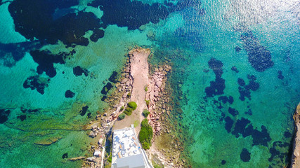 Aerial drone photo of Hamolia area with turquoise colored clear water rocky beaches, Porto Rafti, Mesogeia, Attica, Greece