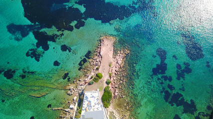 Fototapeta na wymiar Aerial drone photo of Hamolia area with turquoise colored clear water rocky beaches, Porto Rafti, Mesogeia, Attica, Greece