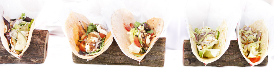 Open tortilla wrap with chicken breast and vegetables