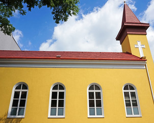 Small church and tree leaves