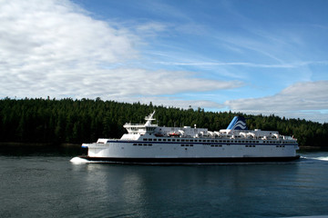 Fototapeta na wymiar Ferry sailing through the isles of the Strait of Georgia, British Columbia, Canada