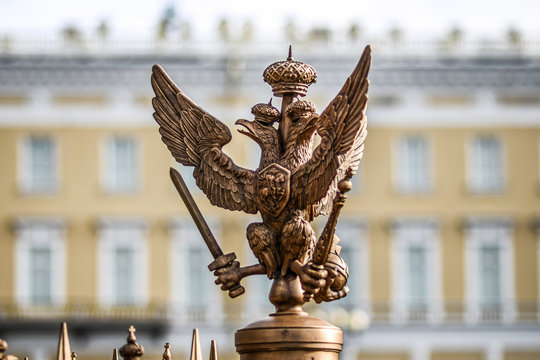 Sculpture eagle in crown, symbol of imperial Russia in front of palace in Petersurg.
