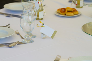detail of a wedding or restaurant table with blank name card, copy space