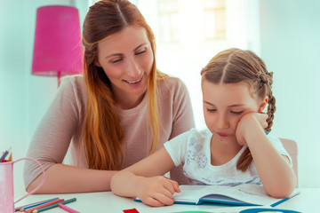mother and daughter learning for school