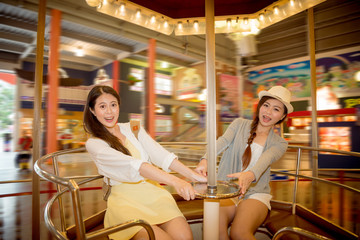 asian pretty girls going to the amusement park
