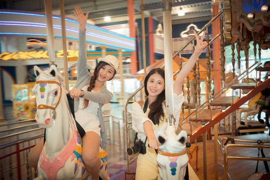 asian pretty girls going to the amusement park