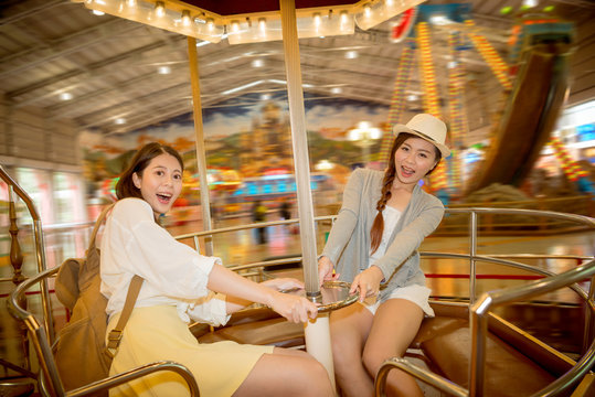 asian pretty girls going to the amusement park