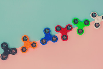 trendy fidget spinners - styled pop art flat lay scene with generic design spinners, retro toned