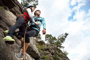 young couple in love climbers