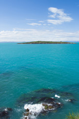 Small Island In The Sea On Sunny Day