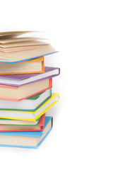 Book stacking. Open book, hardback books on white background. Back to school. Copy space for text.